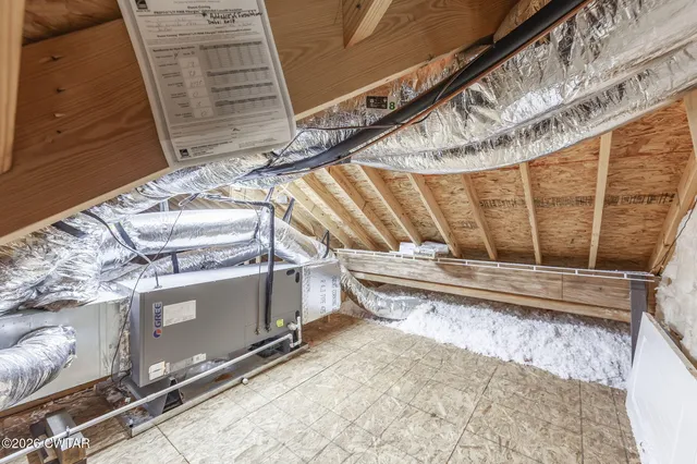 a living room with furniture and large windows