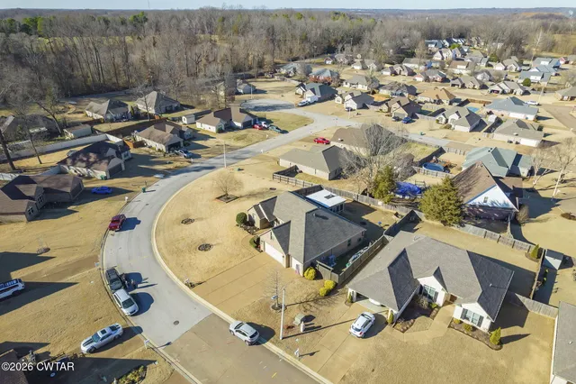 an aerial view of residential house with parking space
