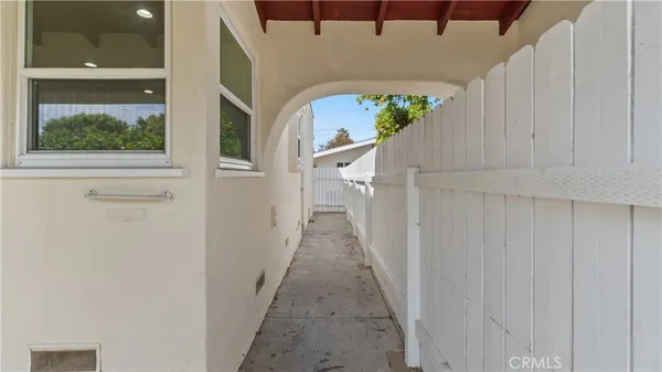 a view of a hallway with a window