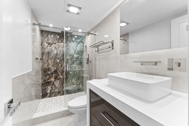 a bedroom with a bed and a washer dryer