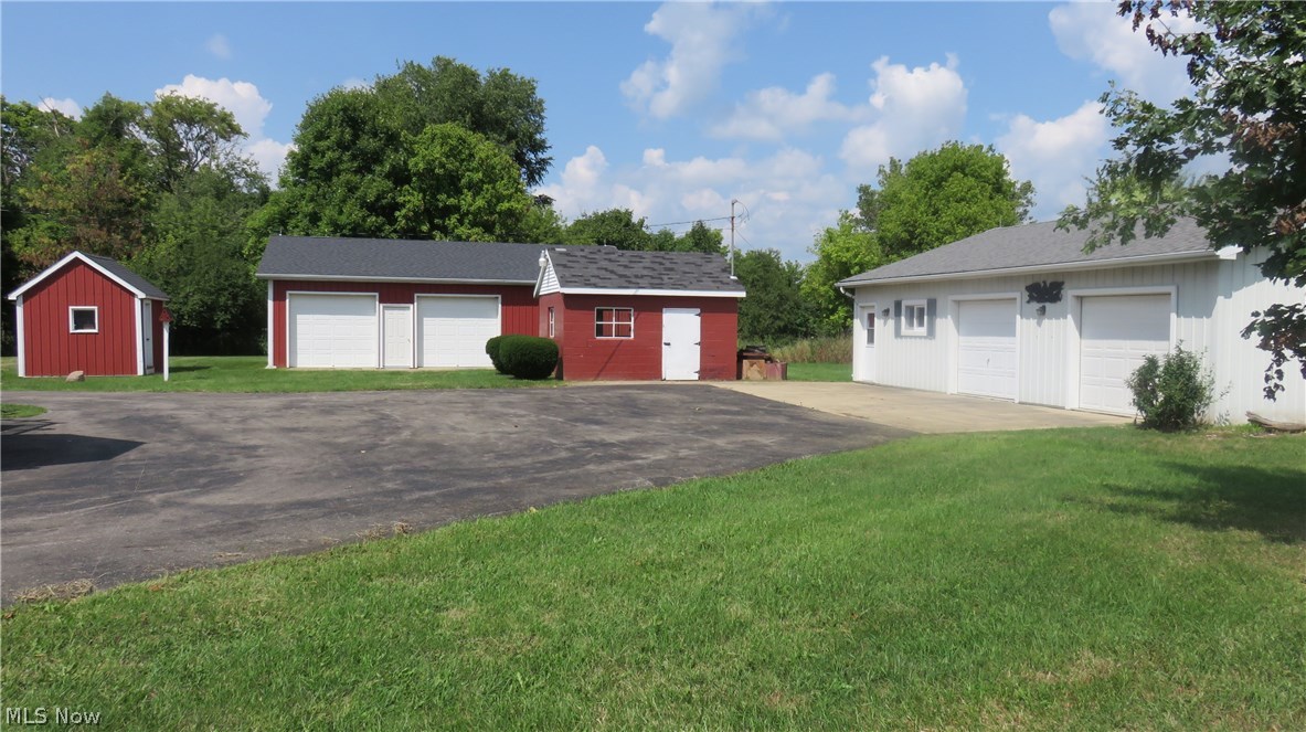 4  garage doors on the outbuildings.  Those have electric.  The white workshop also has heat.