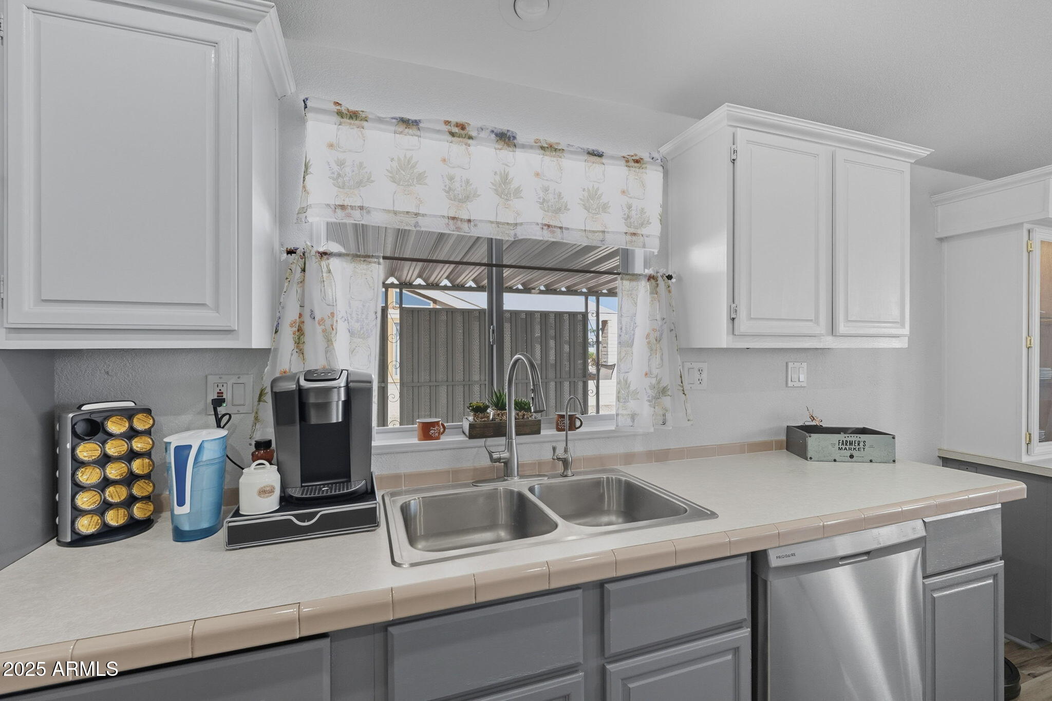 3700 South Tomahawk Road, Unit 39 Apache Junction, AZ 85119 - Photo 23 of 53 a kitchen with stainless steel appliances granite countertop a sink and cabinets