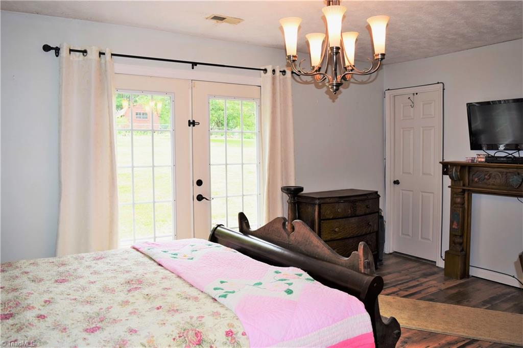7833 Summerfield Road Summerfield, NC 27358 - Photo 10 of 30 French doors to patio from master bedroom