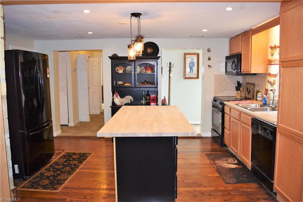 7833 Summerfield Road Summerfield, NC 27358 - Photo 4 of 30 View of kitchen from living room