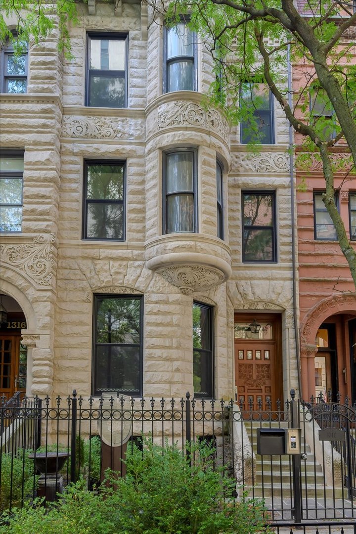 a front view of a house with glass windows