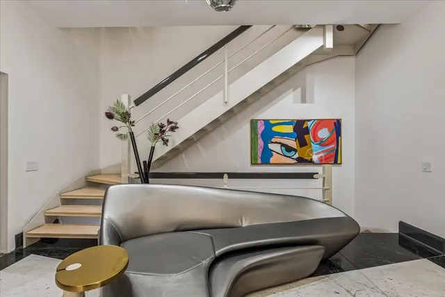 a view of a living room with furniture