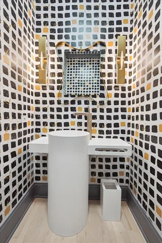 a living room with chairs and a flat screen tv