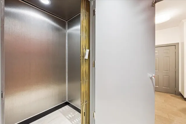 a kitchen with stainless steel appliances granite countertop a stove and a refrigerator