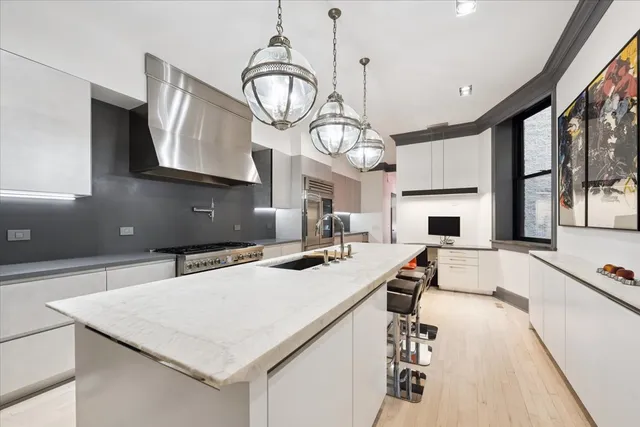 a bedroom with a bed and glass wall painting