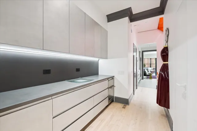 a living room with furniture a window and a flat screen tv