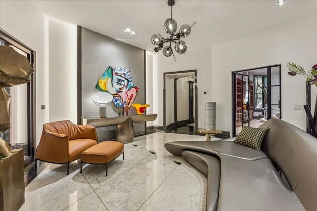 a room with furniture and a potted plant