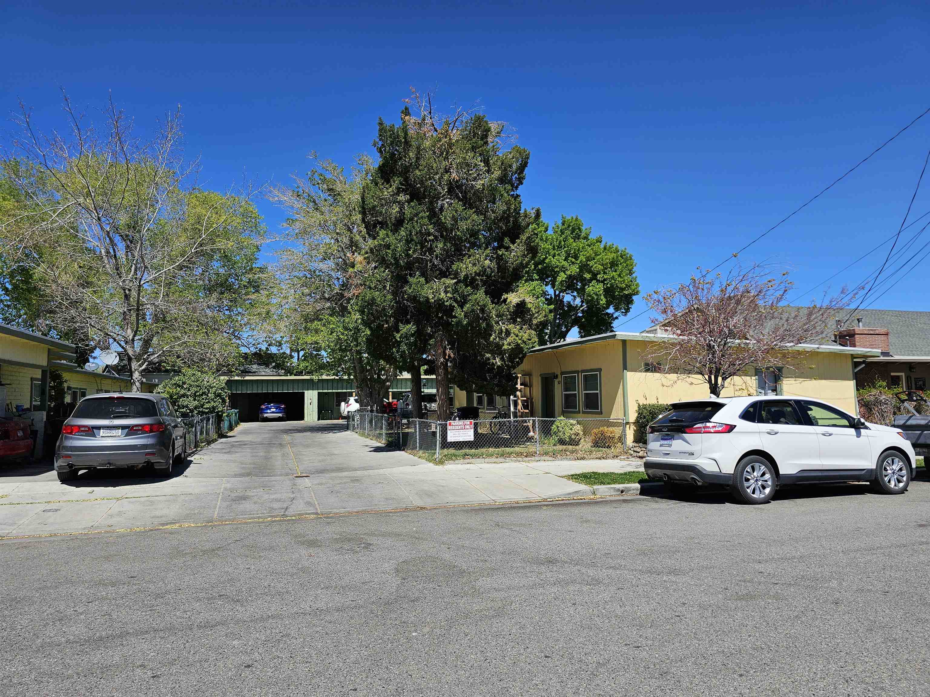 363 Short Street Bishop, CA 93514 - Photo 3 of 17 Yellow-painted exterior with multiple windows