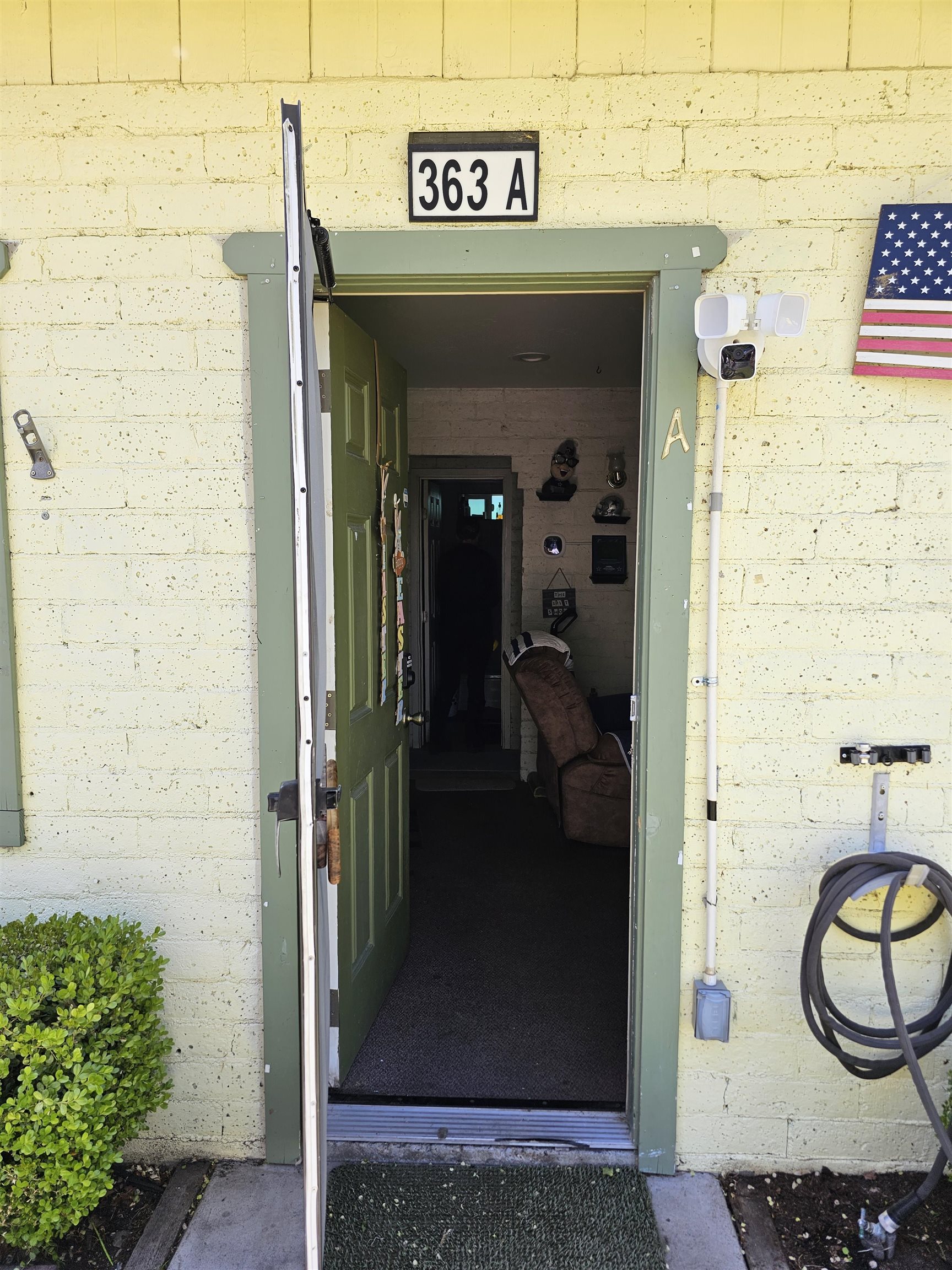 363 Short Street Bishop, CA 93514 - Photo 6 of 17 Front entrance with light yellow painted brick exterior