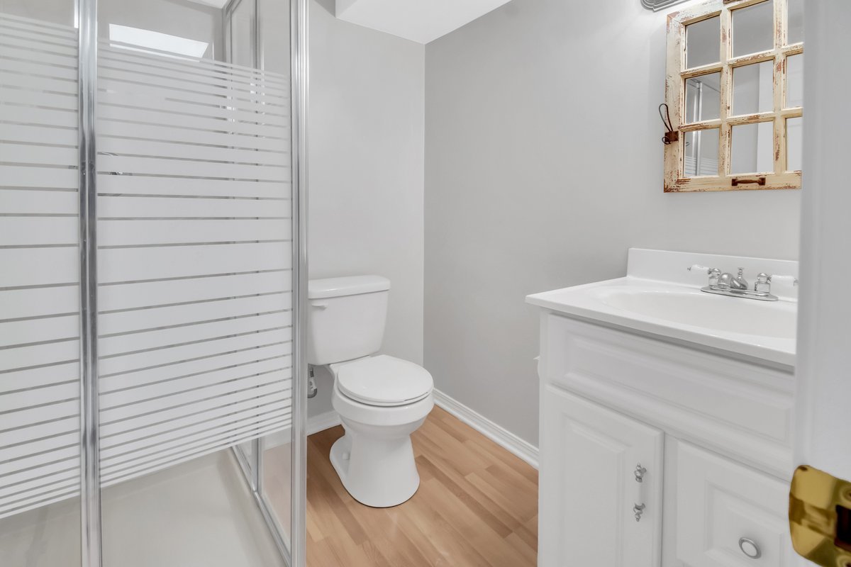 3420 Parliament Lane Naperville, IL 60564 - Photo 15 of 47 a white toilet sitting next to a bathroom sink