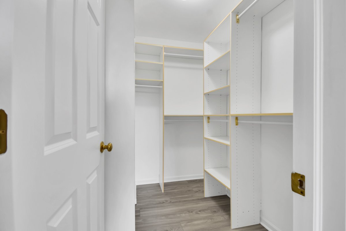 3420 Parliament Lane Naperville, IL 60564 - Photo 24 of 47 a view of walk in closet with empty racks