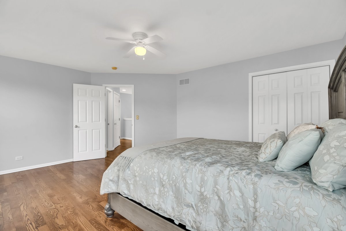 3420 Parliament Lane Naperville, IL 60564 - Photo 28 of 47 a bed room with a bed and a ceiling fan