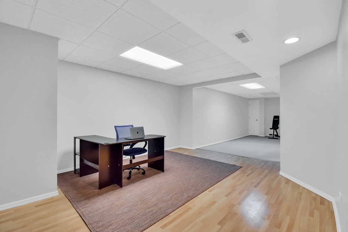 3420 Parliament Lane Naperville, IL 60564 - Photo 36 of 47 a view of a workspace with furniture and wooden floor