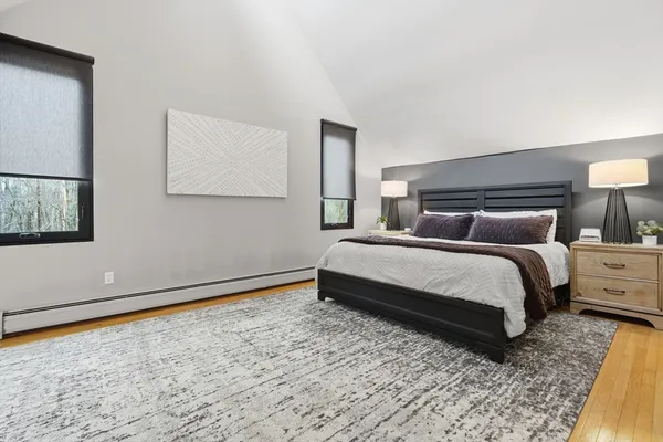 a bedroom with a bed and night stand