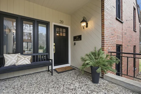 a potted plant sitting in front of a house