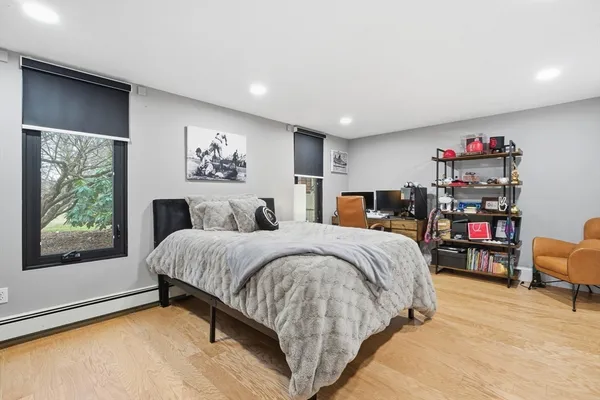 a spacious bedroom with a large bed and a window