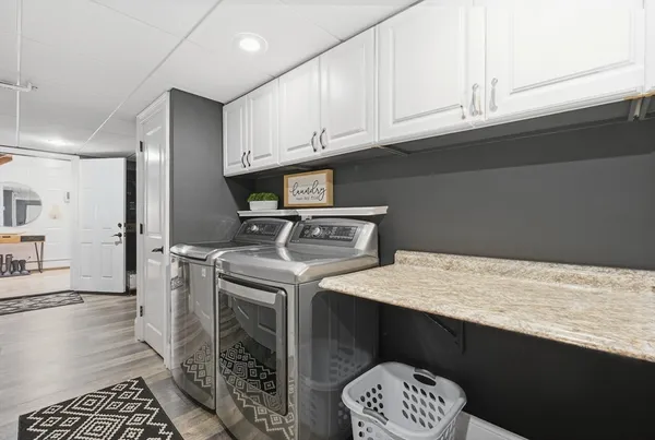 a kitchen with a sink a stove and cabinets