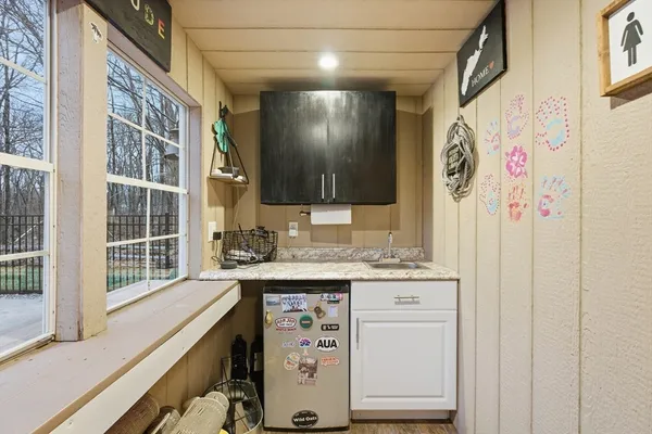 a view of a kitchen with a sink and dishwasher