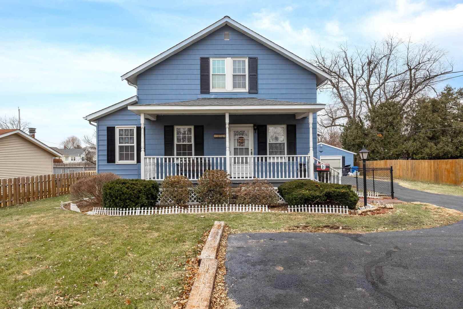 1806 41st Street Moline, IL 61265 - Photo 1 of 35 a front view of a house with garden