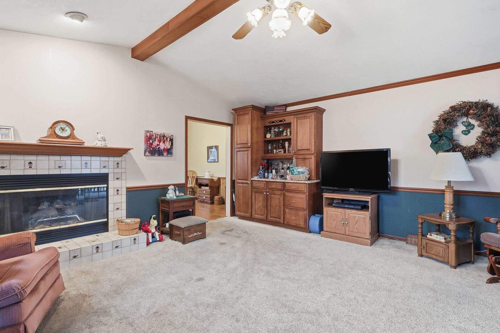 1806 41st Street Moline, IL 61265 - Photo 13 of 35 a view of a livingroom with furniture and a flat screen tv