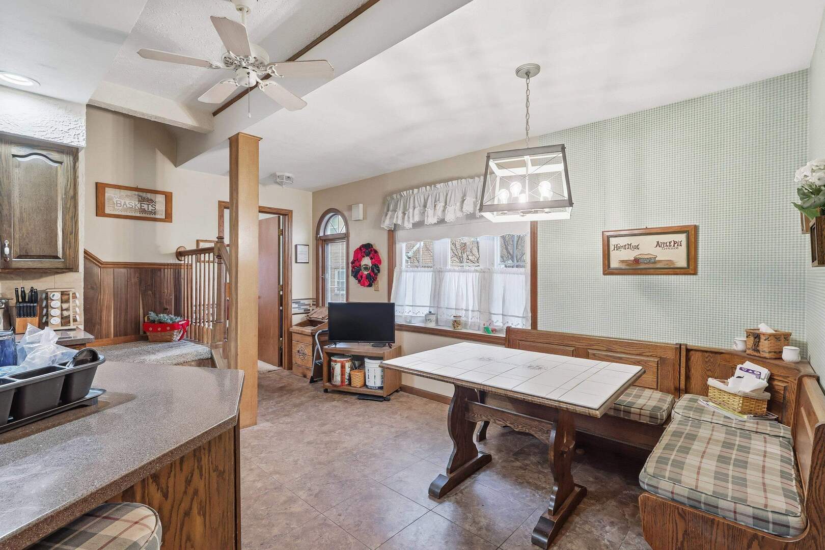 1806 41st Street Moline, IL 61265 - Photo 15 of 35 a view of a workspace with furniture and a kitchen