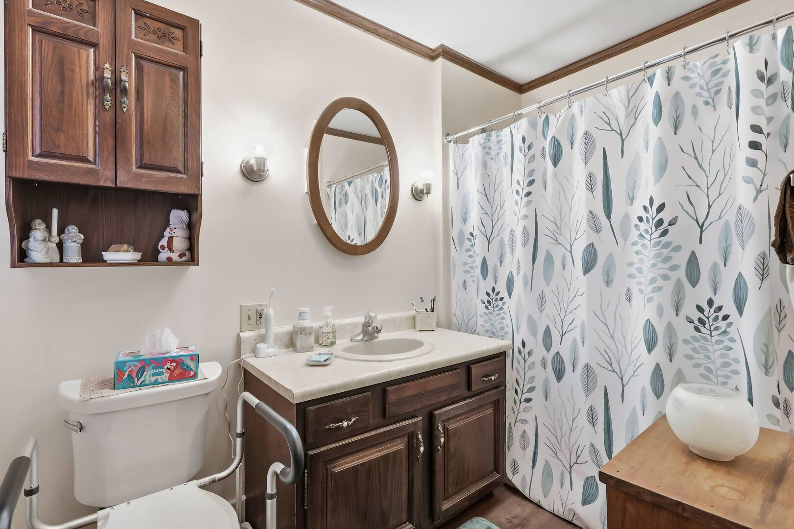 1806 41st Street Moline, IL 61265 - Photo 22 of 35 a bathroom with a sink a toilet and a shower curtain