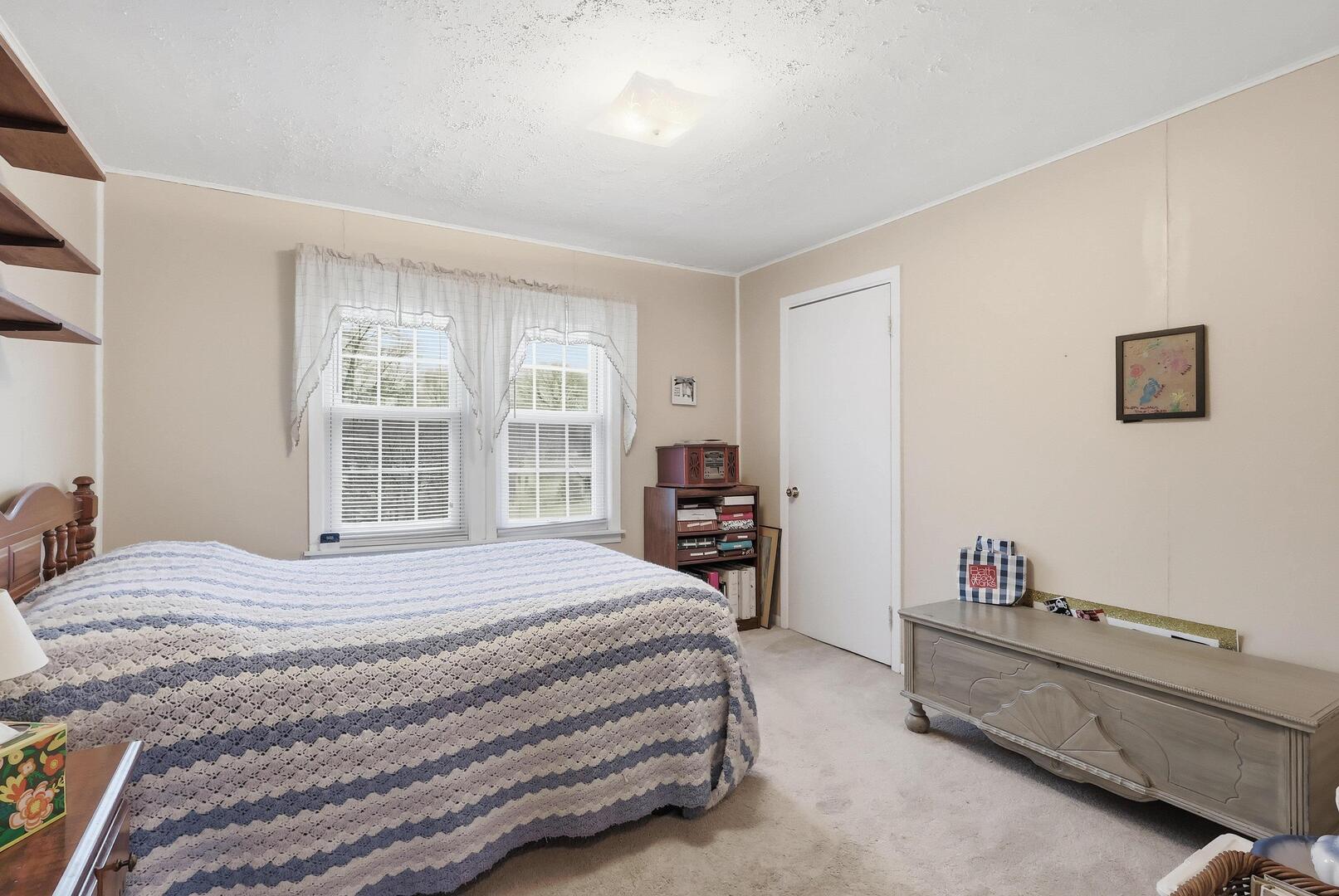 1806 41st Street Moline, IL 61265 - Photo 25 of 35 a bedroom with a bed and a window