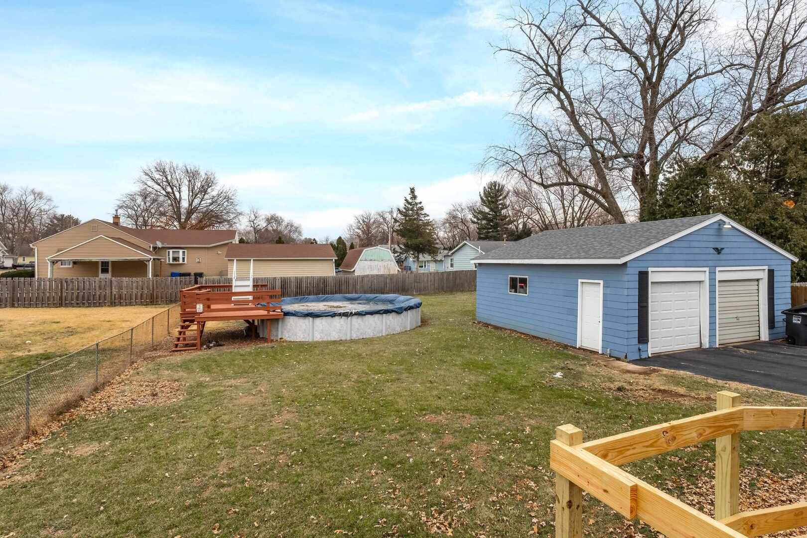 1806 41st Street Moline, IL 61265 - Photo 35 of 35 a view of a house with backyard and trees in the background
