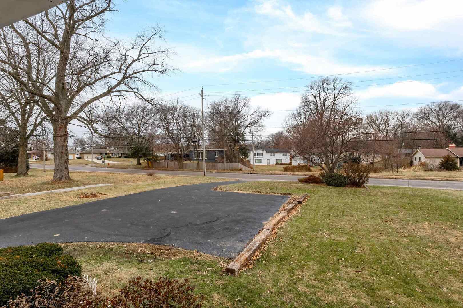 1806 41st Street Moline, IL 61265 - Photo 5 of 35 a view of road with with large trees