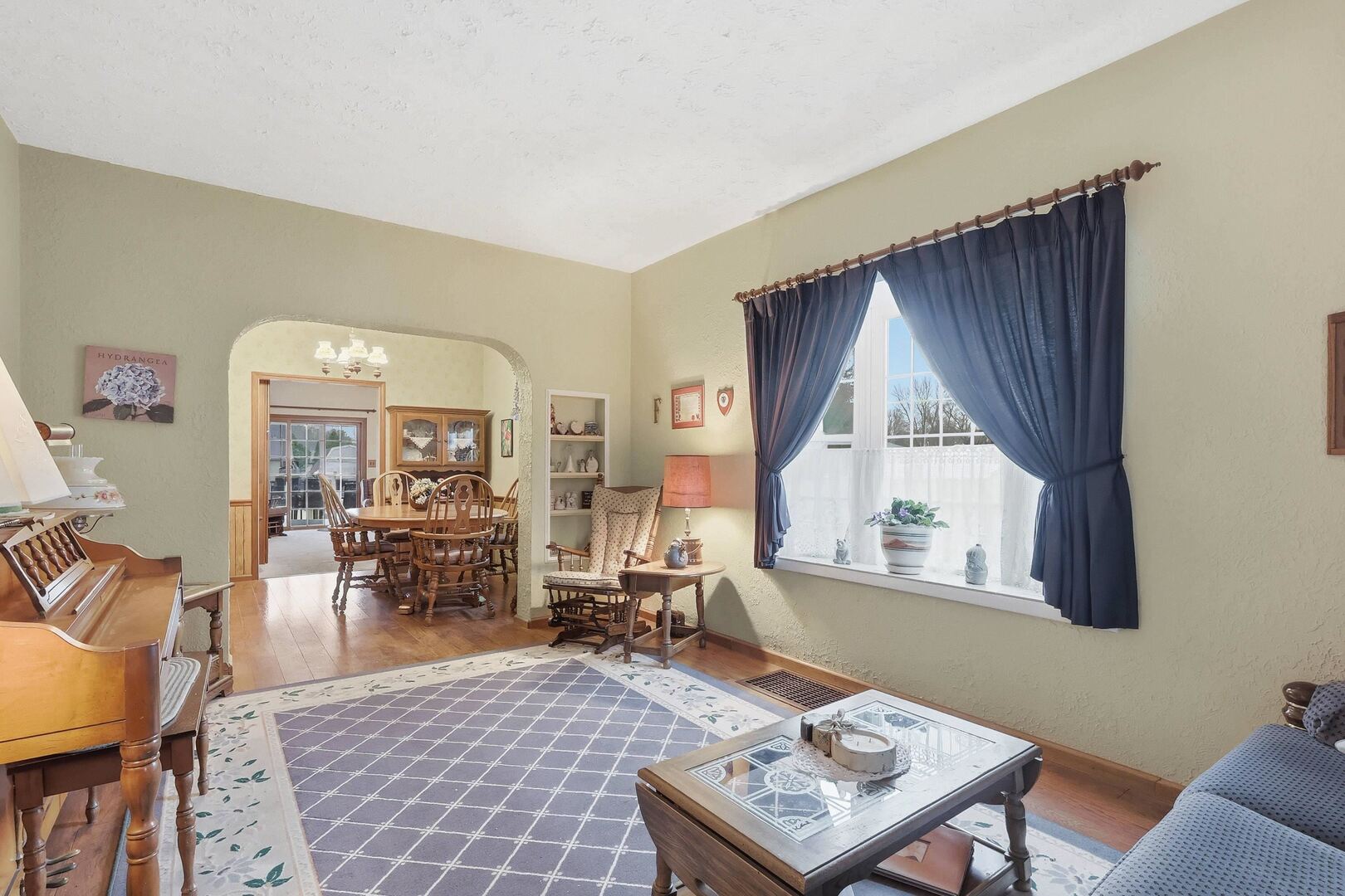 1806 41st Street Moline, IL 61265 - Photo 6 of 35 a living room with furniture a rug and a window