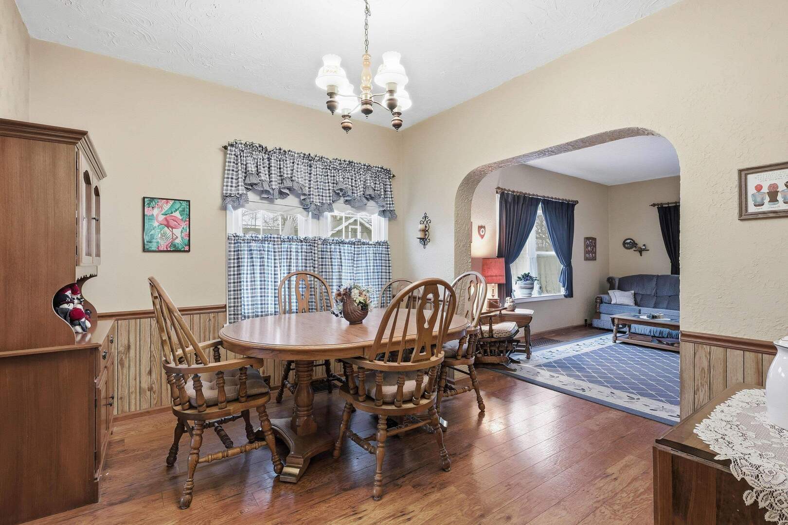 1806 41st Street Moline, IL 61265 - Photo 9 of 35 a dining room with furniture a chandelier and wooden floor