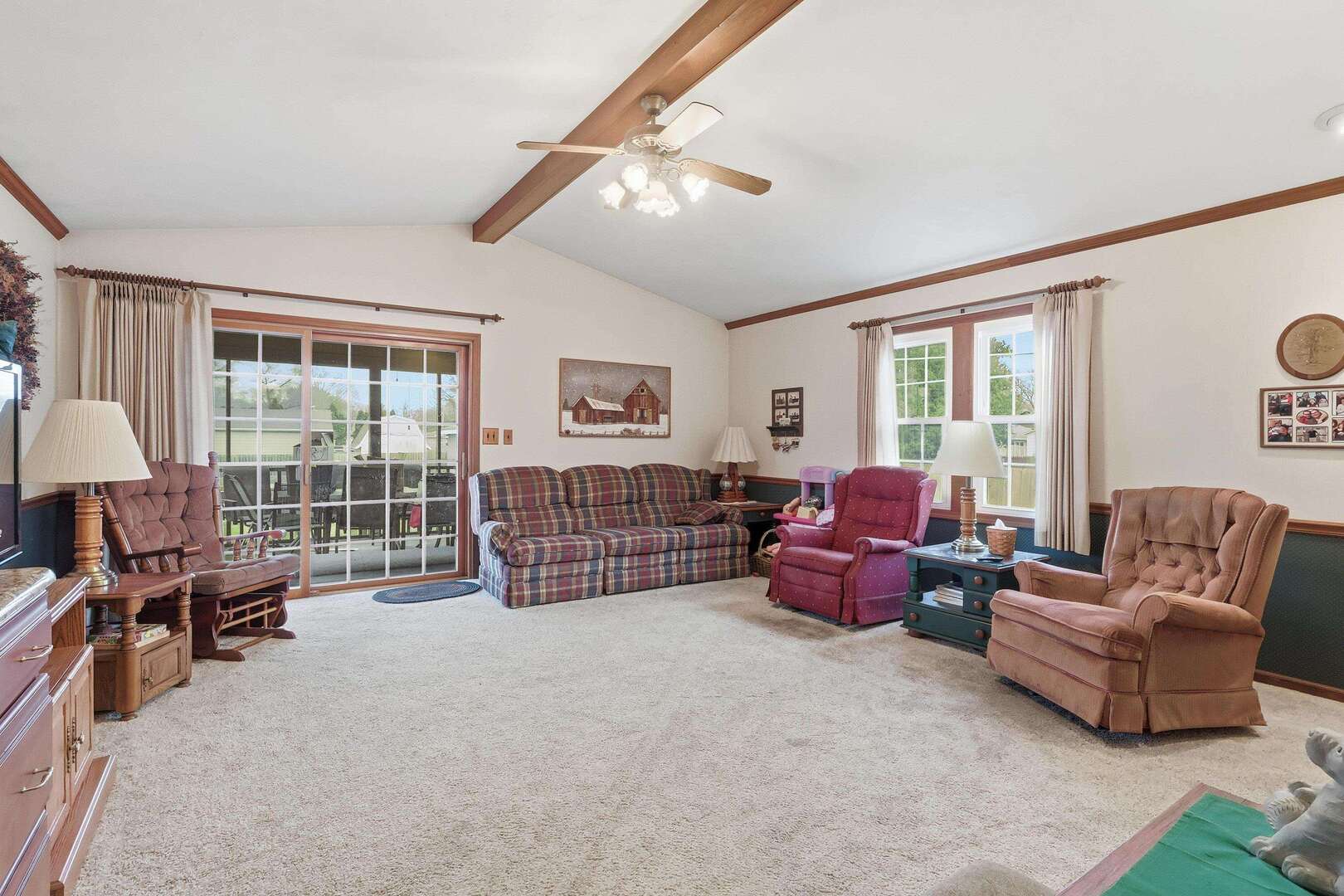 1806 41st Street Moline, IL 61265 - Photo 10 of 35 a living room with furniture a large window and a chandelier