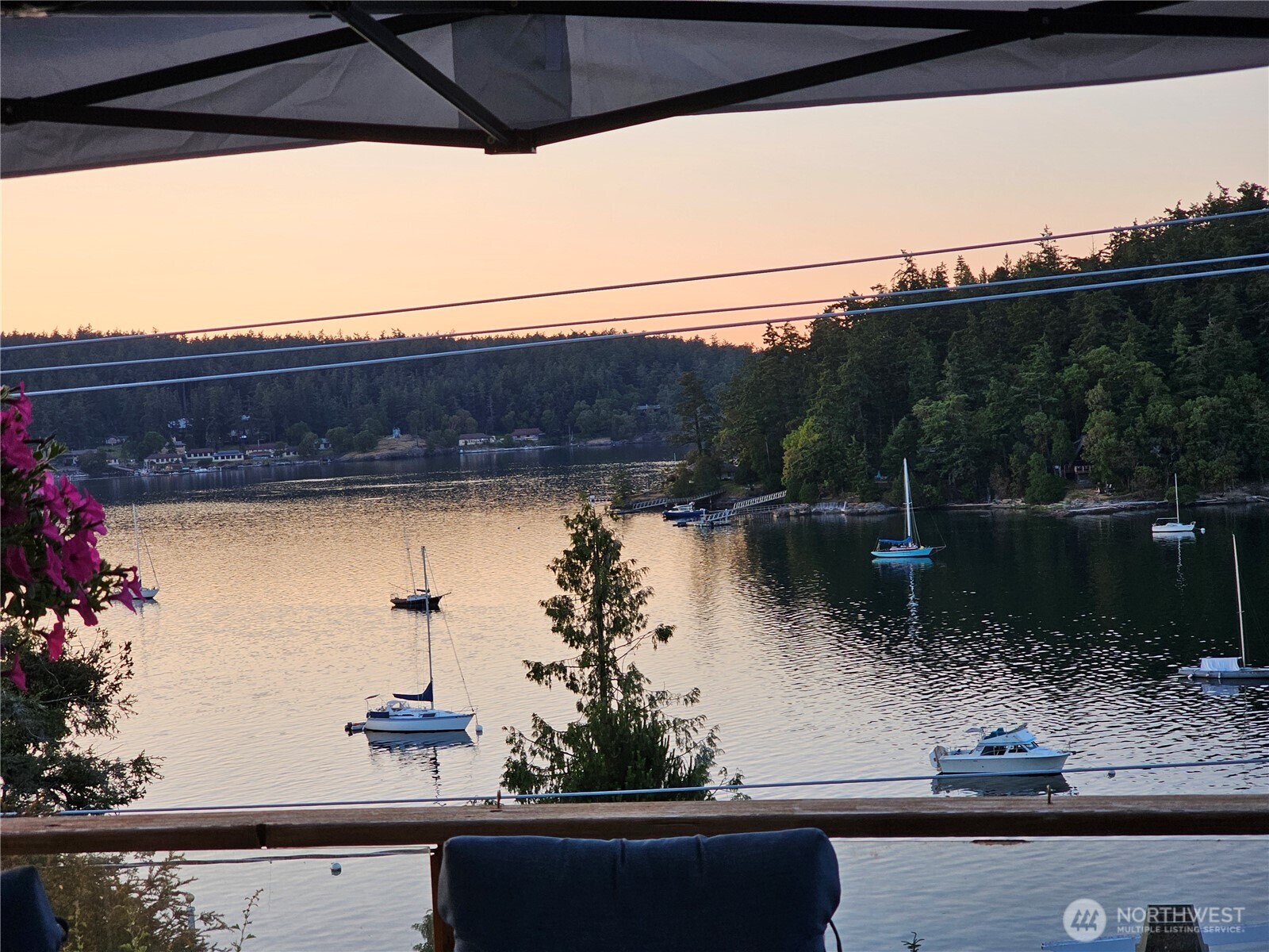 460 Harrison Street Friday Harbor, WA 98250 - Photo 14 of 31 a view of a lake with a bench and trees in the background