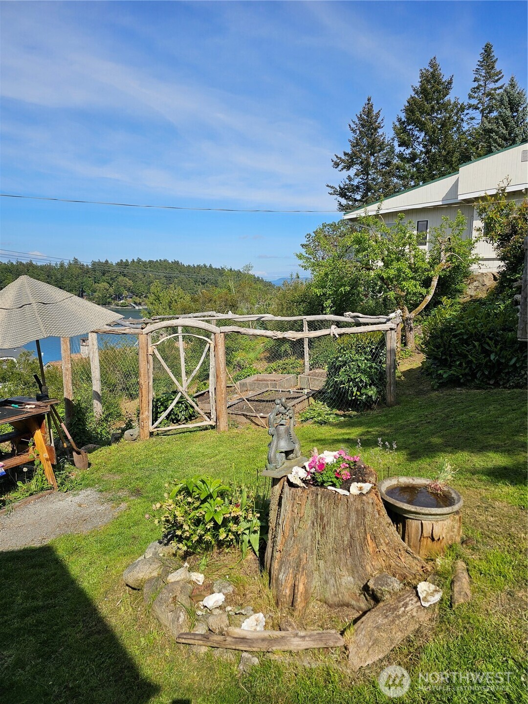 460 Harrison Street Friday Harbor, WA 98250 - Photo 30 of 31 a view of a swimming pool with lawn chairs under an umbrella