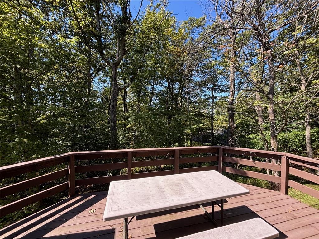 1821 Eagles Ridge Terrace Hidden Valley, PA 15502 - Photo 11 of 49 a view of a balcony with wooden floor and fence