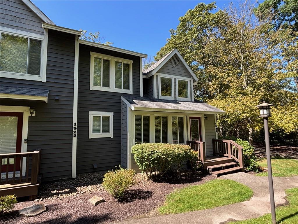 1821 Eagles Ridge Terrace Hidden Valley, PA 15502 - Photo 2 of 49 a front view of a house with a yard