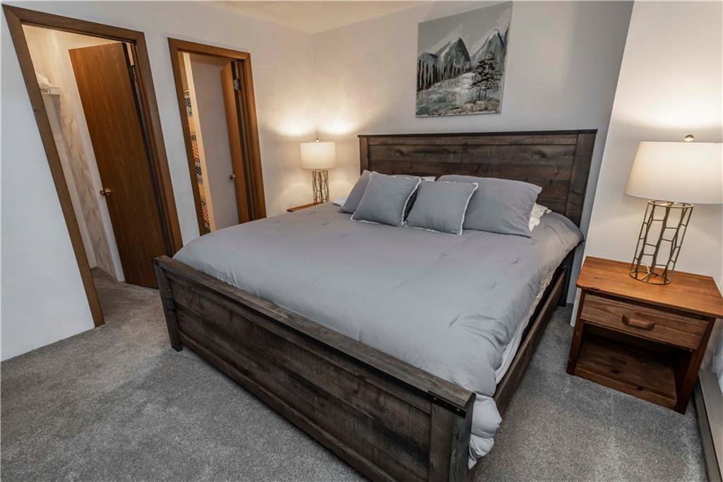 1821 Eagles Ridge Terrace Hidden Valley, PA 15502 - Photo 22 of 49 a bed sitting in a bedroom next to a lamp