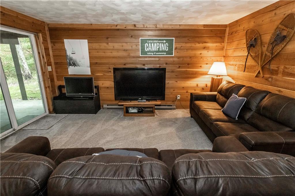 1821 Eagles Ridge Terrace Hidden Valley, PA 15502 - Photo 30 of 49 a living room with furniture and a flat screen tv