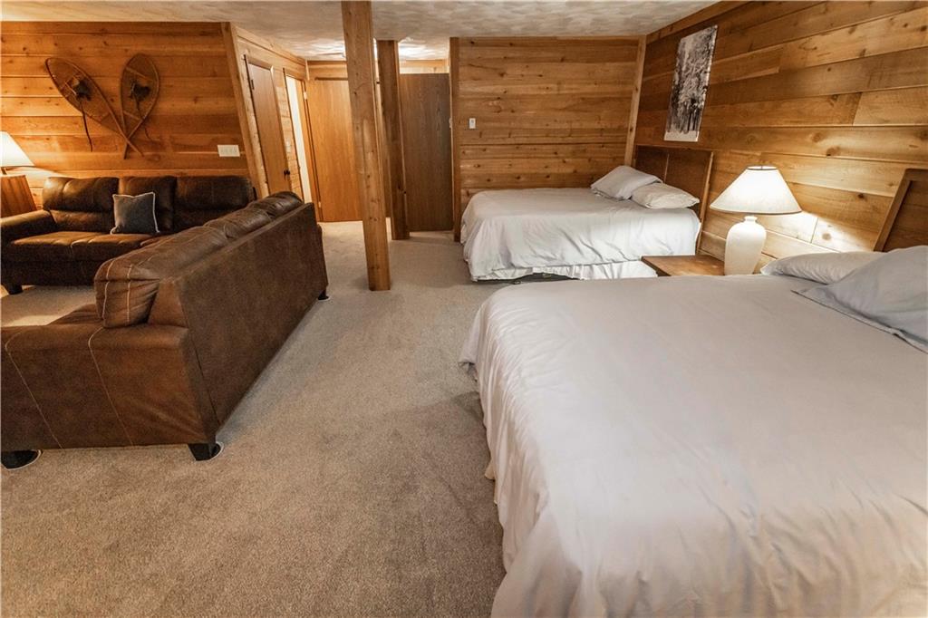 1821 Eagles Ridge Terrace Hidden Valley, PA 15502 - Photo 32 of 49 a bedroom with a bed and lamp