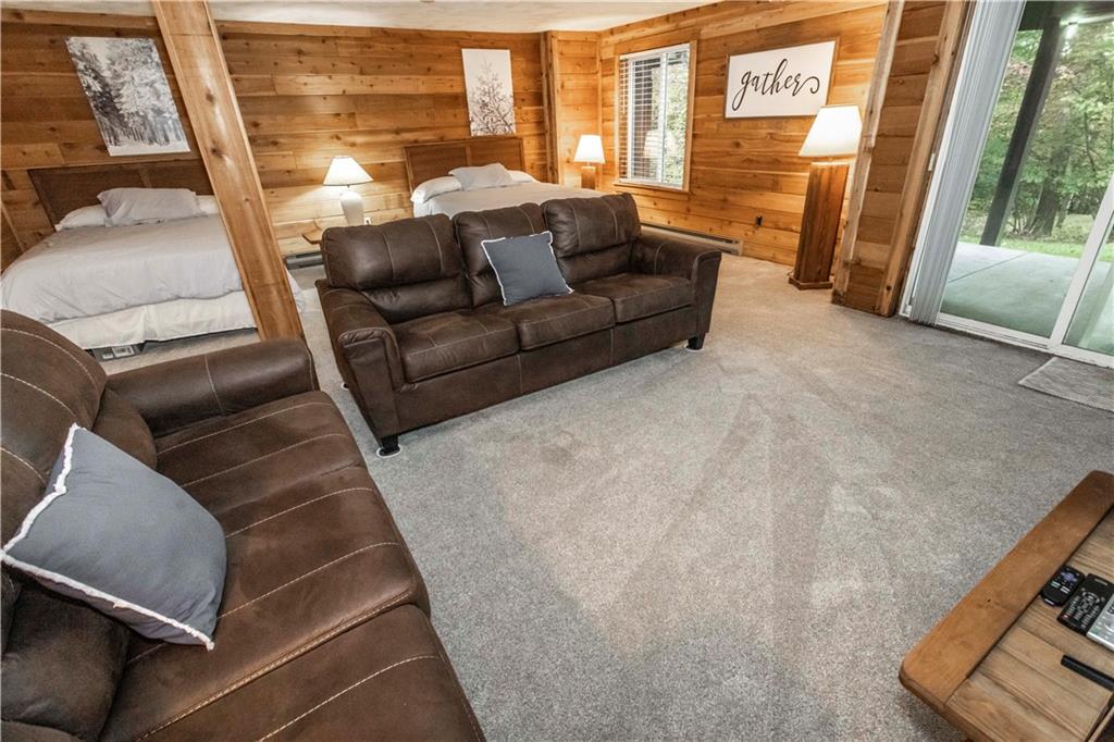 1821 Eagles Ridge Terrace Hidden Valley, PA 15502 - Photo 34 of 49 a living room with furniture and a large window