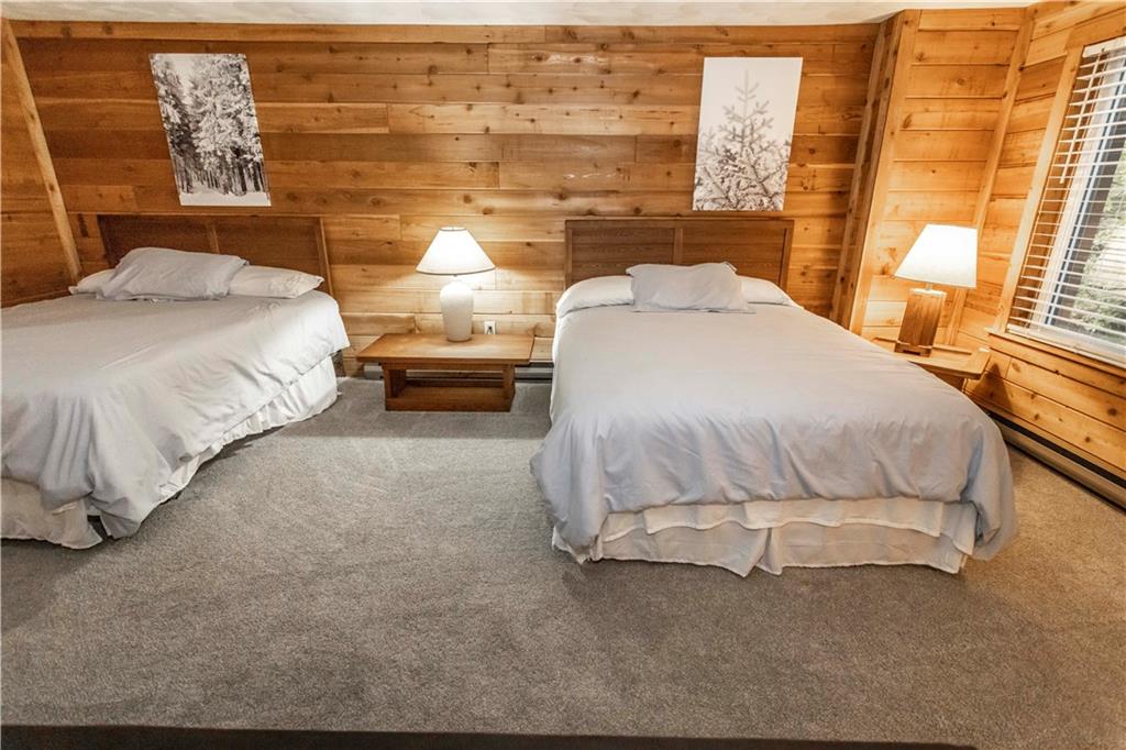 1821 Eagles Ridge Terrace Hidden Valley, PA 15502 - Photo 35 of 49 a bedroom with a bed and a night stand