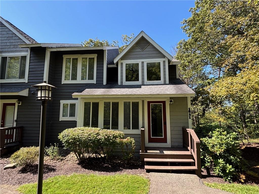 1821 Eagles Ridge Terrace Hidden Valley, PA 15502 - Photo 38 of 49 a front view of a house with a yard