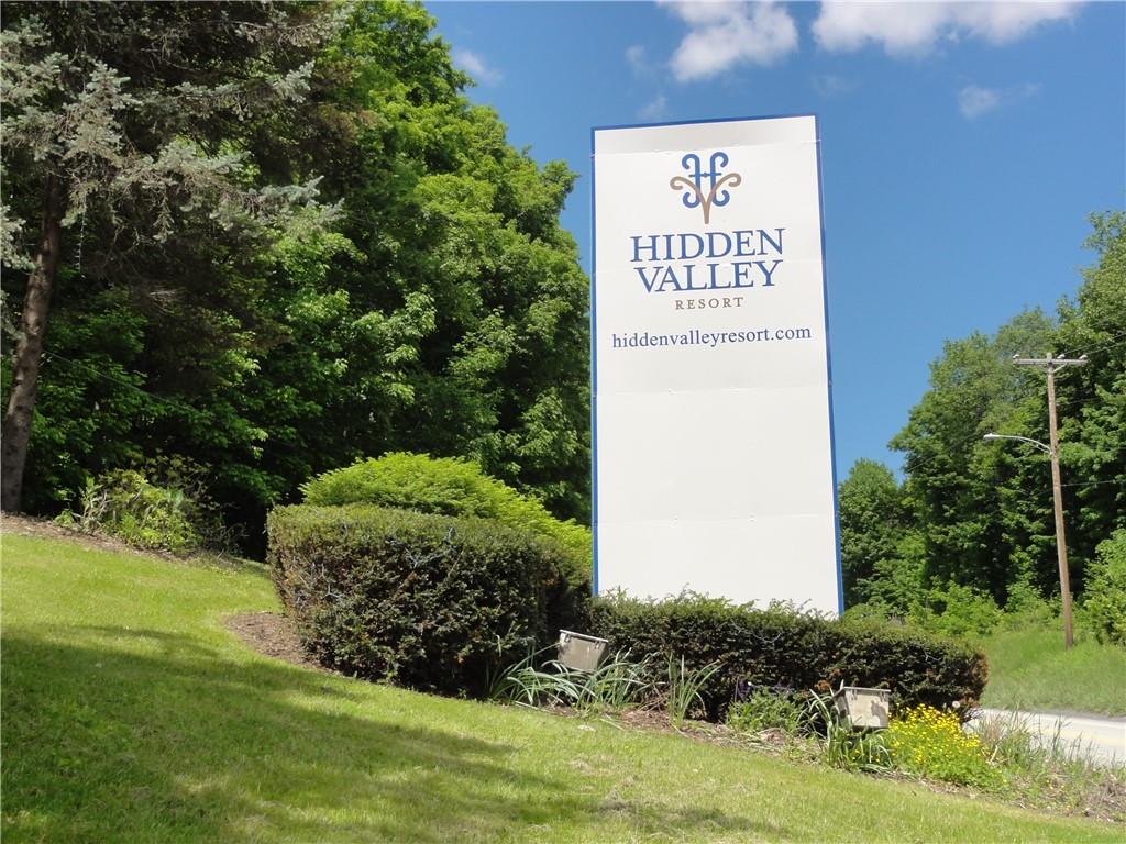 1821 Eagles Ridge Terrace Hidden Valley, PA 15502 - Photo 41 of 49 a sign of golf club on a wall under a tree