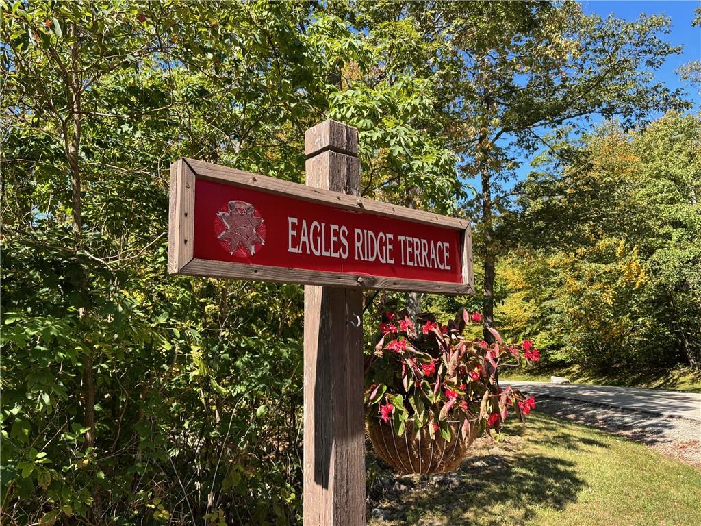 1821 Eagles Ridge Terrace Hidden Valley, PA 15502 - Photo 43 of 49 a street sign that is sitting on a brick wall
