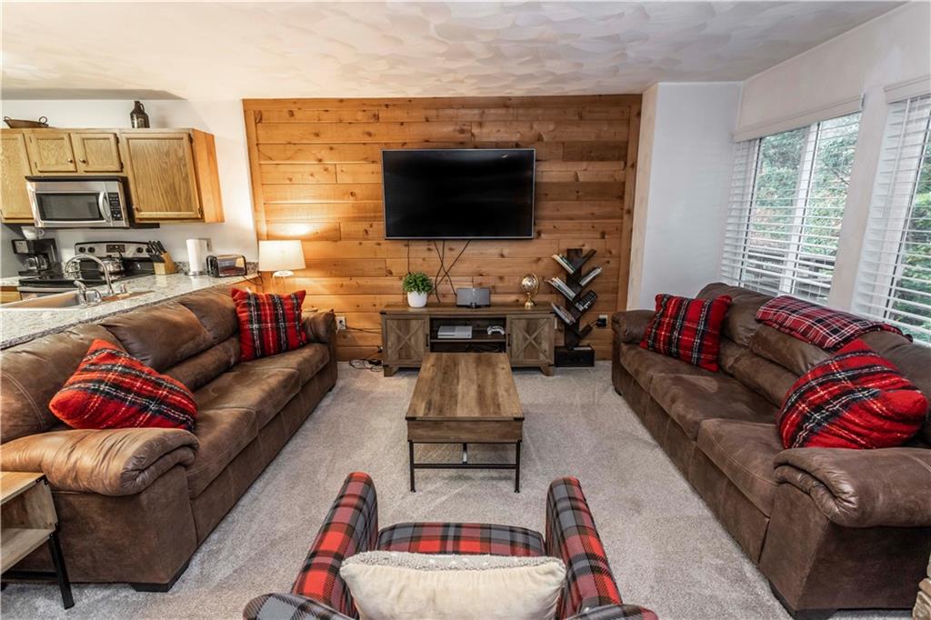 1821 Eagles Ridge Terrace Hidden Valley, PA 15502 - Photo 5 of 49 a living room with furniture fireplace and flat screen tv
