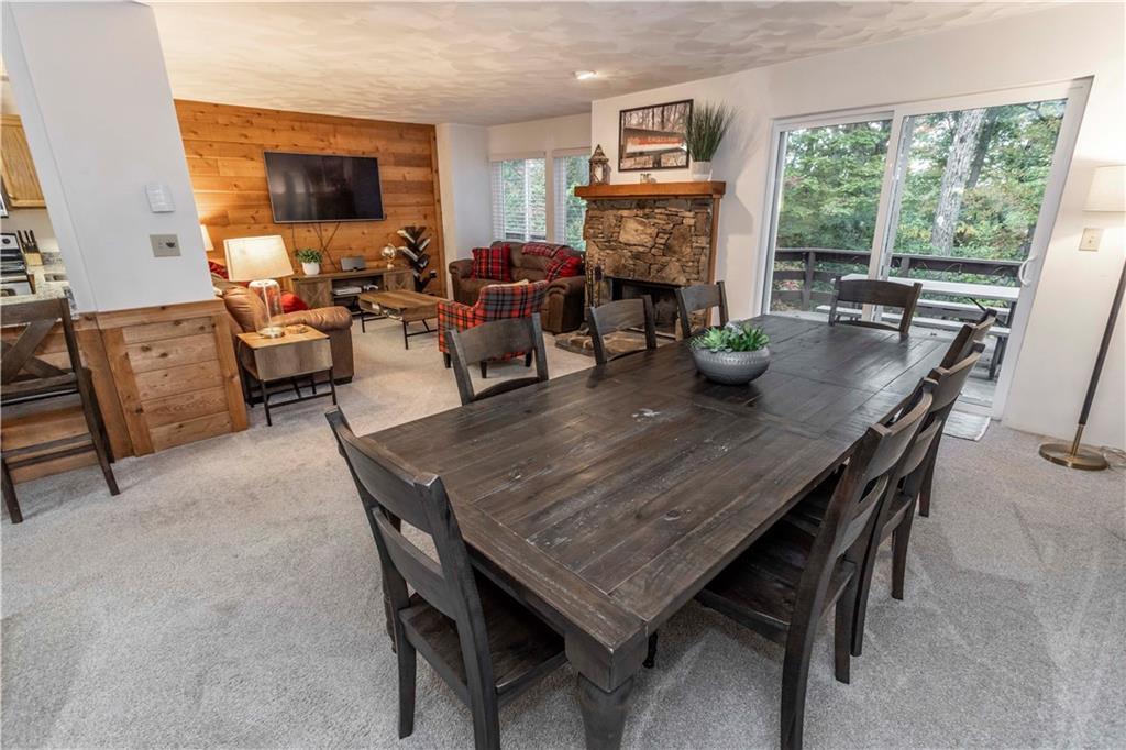 1821 Eagles Ridge Terrace Hidden Valley, PA 15502 - Photo 7 of 49 a dining room with furniture and a fireplace